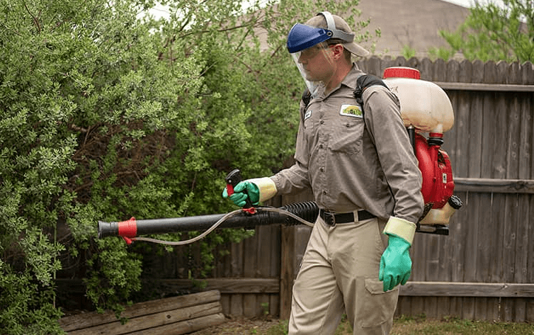 Pest Technician treating mosquitos