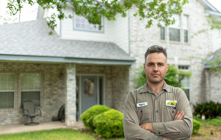 man standing outside a home