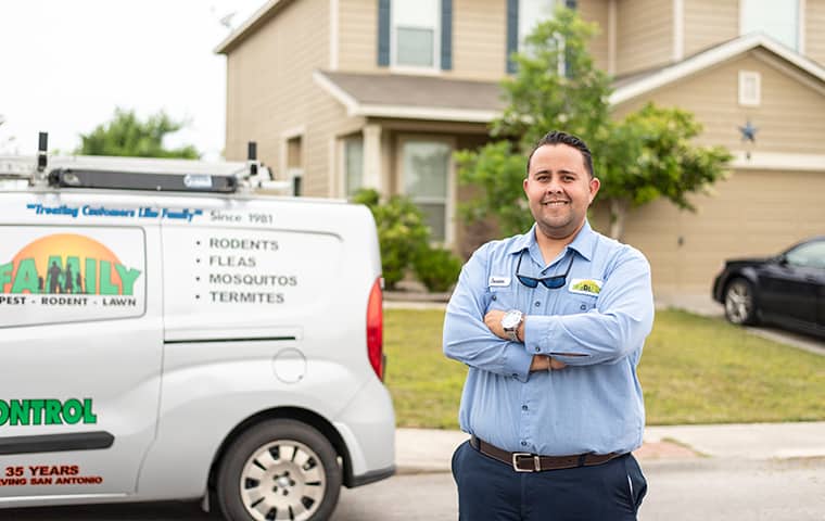 Pest Technician in front of work truck